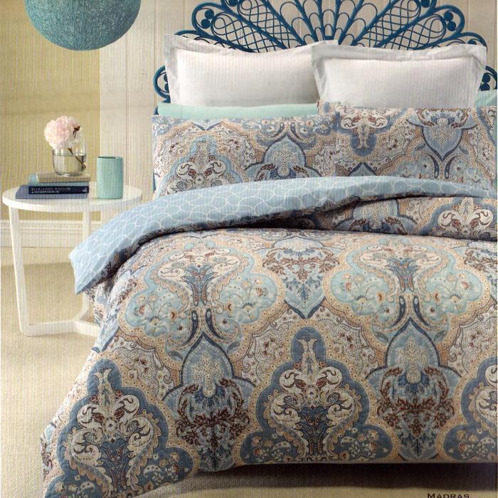 Reversible, Classic, soft colors like white, blue and beige feature on this quilt cover set.